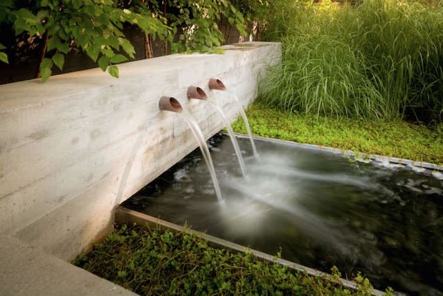  fountain. courtyard entry. pipes out of wall